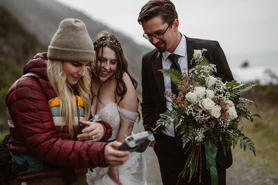 Pilot showing bride and groom drone footage of their elopement