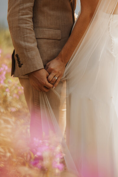 bride and groom holding hands