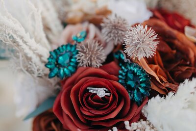 Detail photo of ring in flowers