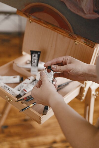 Acrylic paints stored in easel