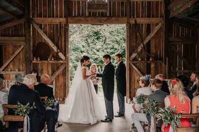 A bride and groom getting married at Nancarrow Fram in Cornwall