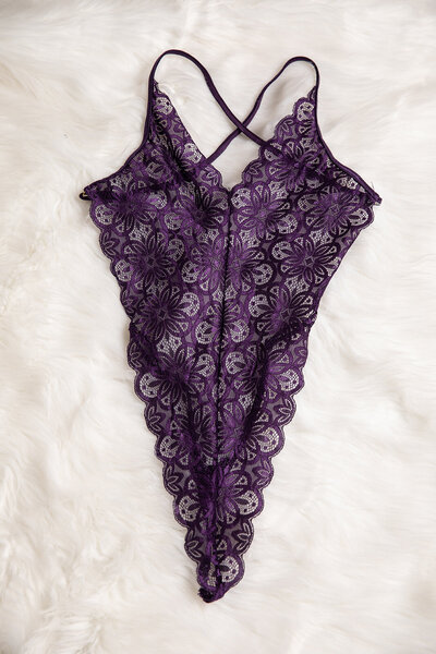 Purple bodysuit in Baton Rouge boudoir studio client closet
