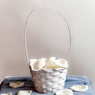 White basket full of white flower petals