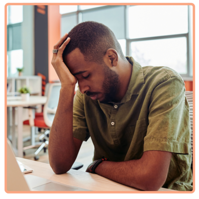 burned out father at desk tired and trying to work