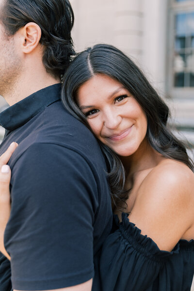 Couple cuddling during engagement session in Hershey, PA