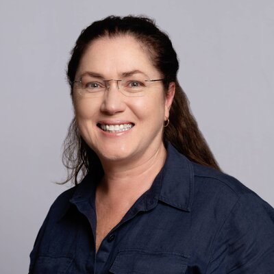 Traditional headshot taken on a white background with classic lighting