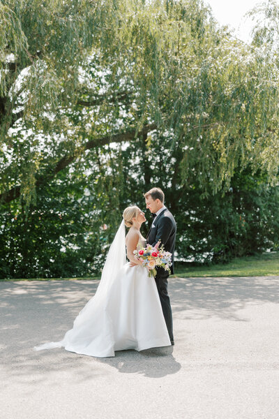 bride and groom posing outdoors