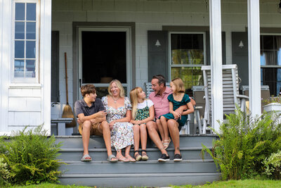 Family sitting on their porch | Family Photography taken by Maine Photographer