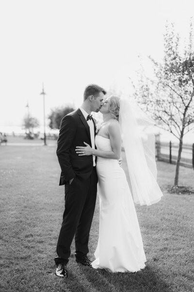 adirtondack sunset wedding with bride and groom kissing