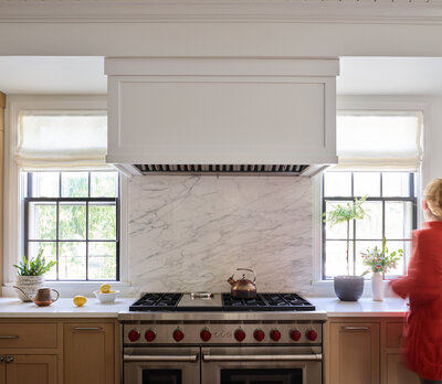 Hingham kitchen designer designed a natural oak kitchen with a marble backsplash in a historic Hingham home, blending classic architecture with modern style.