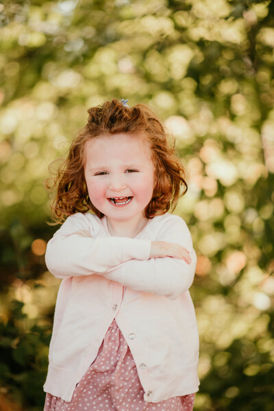 Smiling homeschool student during school photo session with Shannon Kathleen Photography in Minneapolis, praised by parent for capturing authentic personalities.