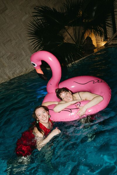 A person sitting on a dresser talking on the phone.