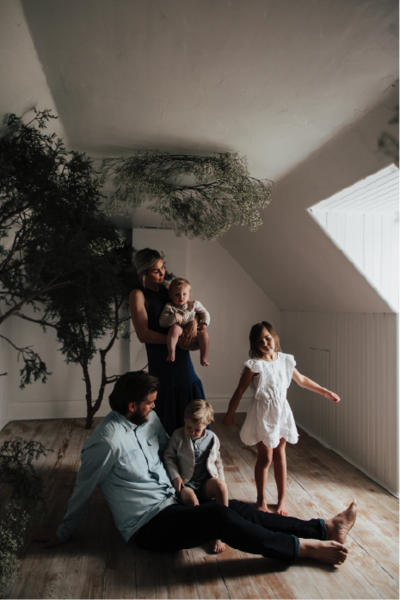 family-in-room-with-trees@2x