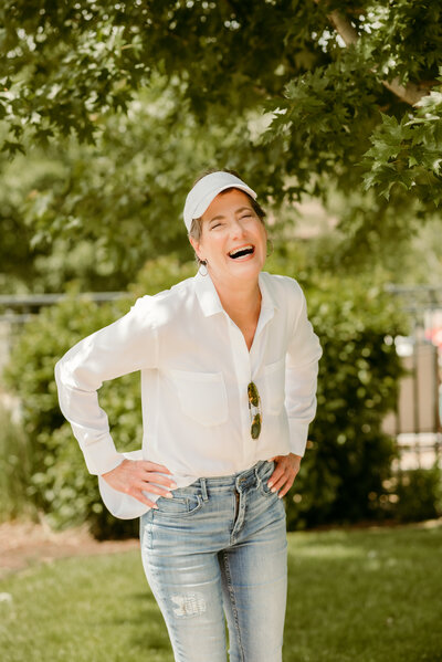 Carolyn sitting comfortably with a joyful expression during her dating photo session in Minneapolis, designed to capture real confidence.