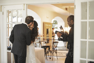 videographer shooting high end wedding couple