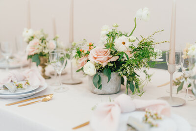 table to floral design with blush and white flowers