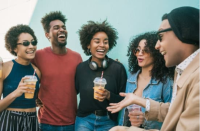 Portrait of multi-ethnic group of friends having fun together and enjoying good time while drinking fresh fruit juice; Nicolas Menijes