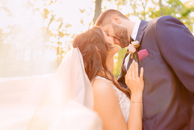 A couple canoodles under the Gramercy Mansion gazebo for Maryland Wedding Photographer