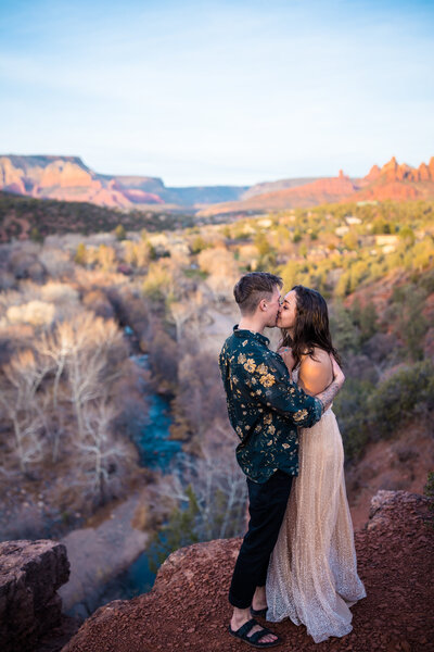 sedona windy engagement session with western couple
