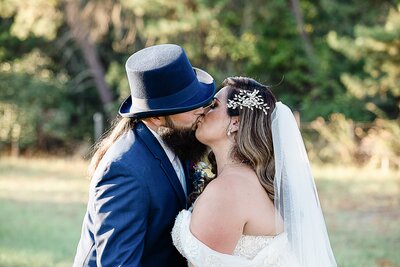 Newlywed couple kissing at Bending Branch Ranch