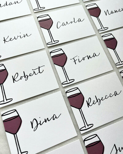 Place cards with red wine glass  illustration and black calligraphy