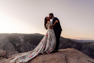 A couple enjoying a sweet moment at the conclusion of their Yosemite Elopement adventure.