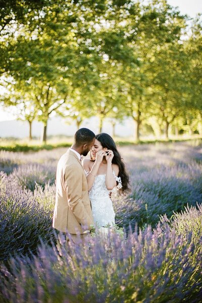 couple stand in lavender field