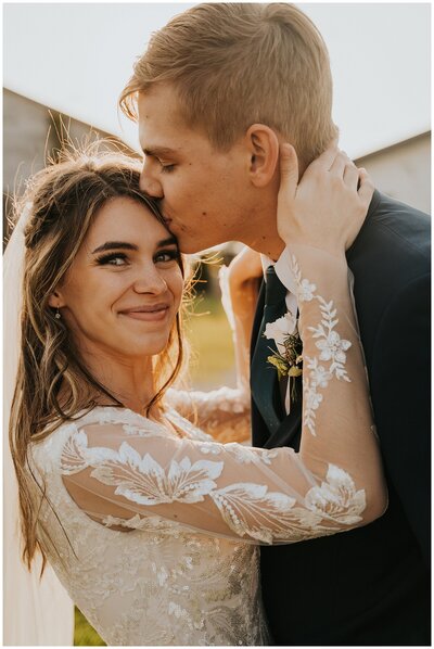 groom kissing bride's forehead in twin falls idaho