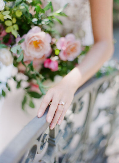 Bride's Hand on Railing Walking Up Stairs Photo