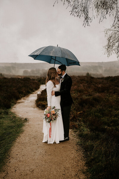 bride and groom hold hands in the garden at amalfi white