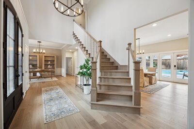 Interior entryway of 17828 Cedar Creek in Dallas, listed by Haven Realty Group. Bright open foyer with staircase and natural light.