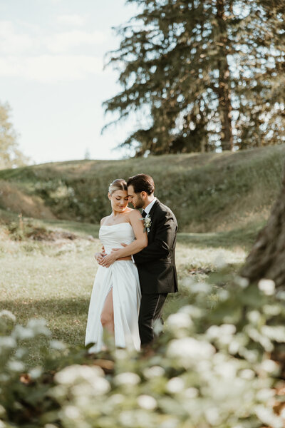 Bride and groom posing in golden hour light in Bucks County PA