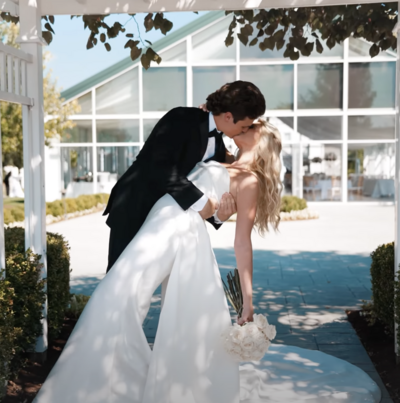 a groom kissing his bride