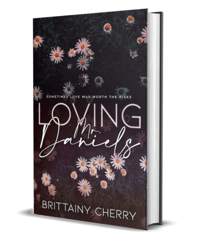 man with beard wearing a white shirt looks down on the cover of the air he breathes by romance author brittainy cherry
