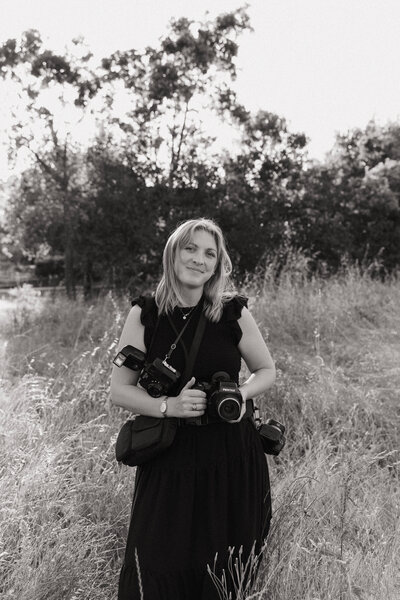 JJ standing on a beach, up close with arms crossed