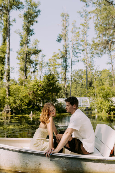 flat lay details, of the brides keepsakes, of her rings, necklace, earrings and invites. 