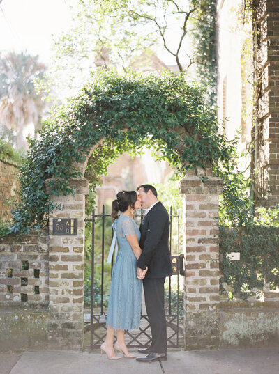 couple on the streets of downtown charleston for their engagement session