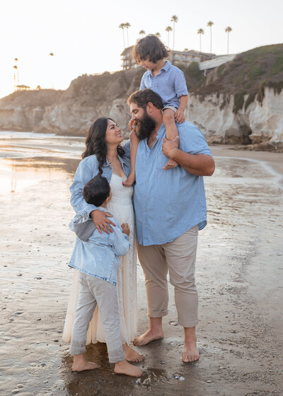 Family Photoshoot in Pismo Beach on the Central Coast with family candid fun hugs