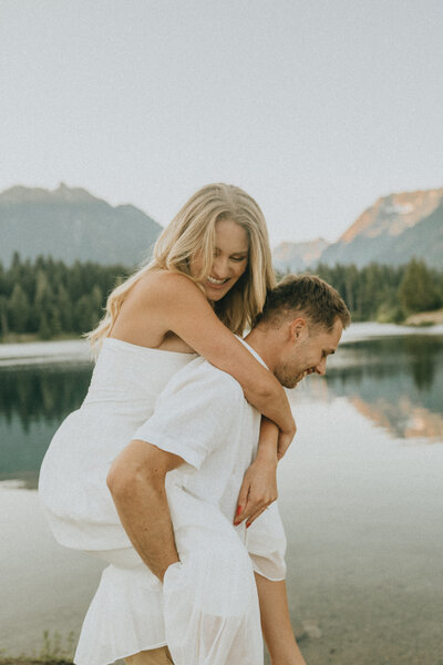 man giving piggy back ride to his partner