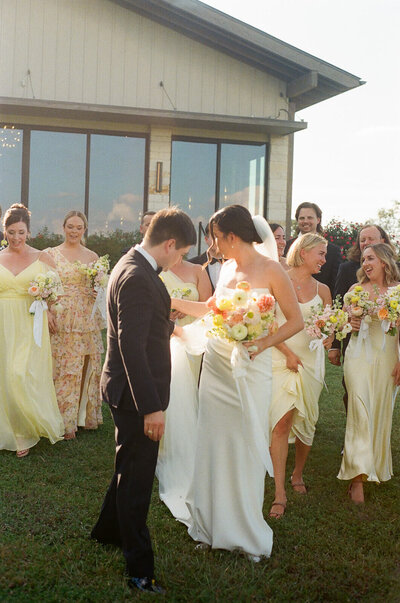 couple and their wedding party during golden hour