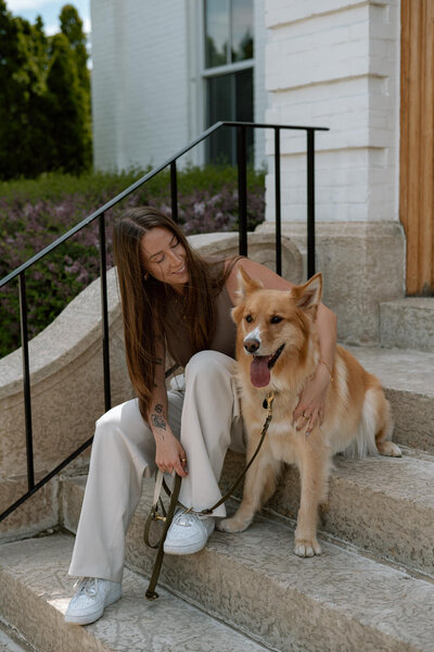 woman hugging dog