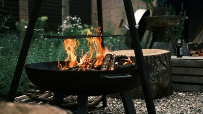 Enjoying a backyard fire in a cozy mountain property.