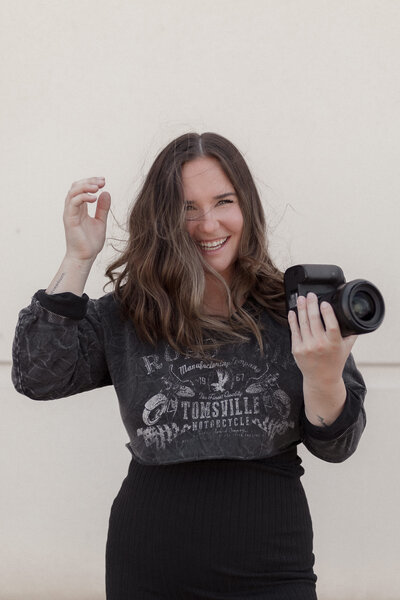 woman posing with camera