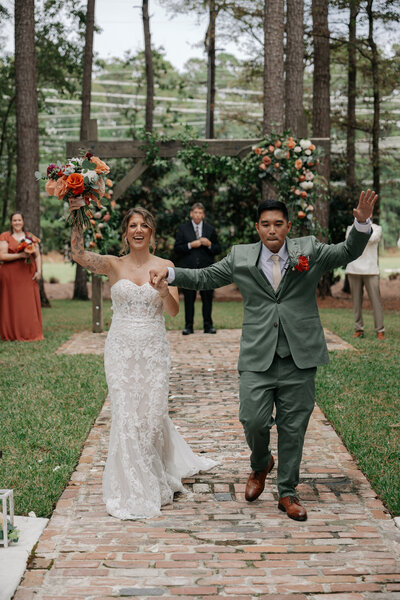 Bride and groom celebrating they just got married in Charleston SC