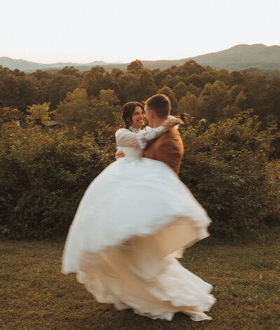 Couple sharing a quiet moment in a lush Georgia forest during their elopement.