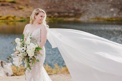 Bride laughs in bridal portrait at Loveland Pass, Colorado.