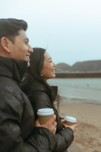 couple spend a morning together in stonehaven having coffee after their wedding day