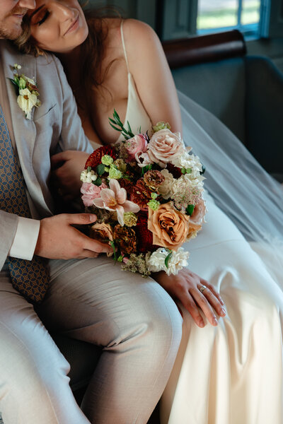 Boston Bride holding a beautiful blush and whites floral bouquet by Prose Florals