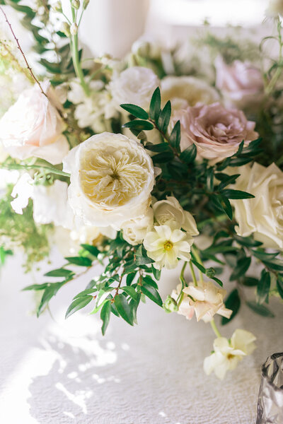 Spring Wedding flowers in colors of dusty pink, cream, white, sage, green, low floral centerpiece. Wedding and Event floral design by Rosemary and Finch in Nashville, TN.