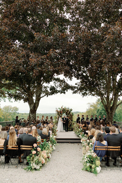 Barn at Willow Hill Event Venue set for a wedding reception, featuring an elegant tablescape with fresh yellow florals, creating a beautiful and inviting atmosphere